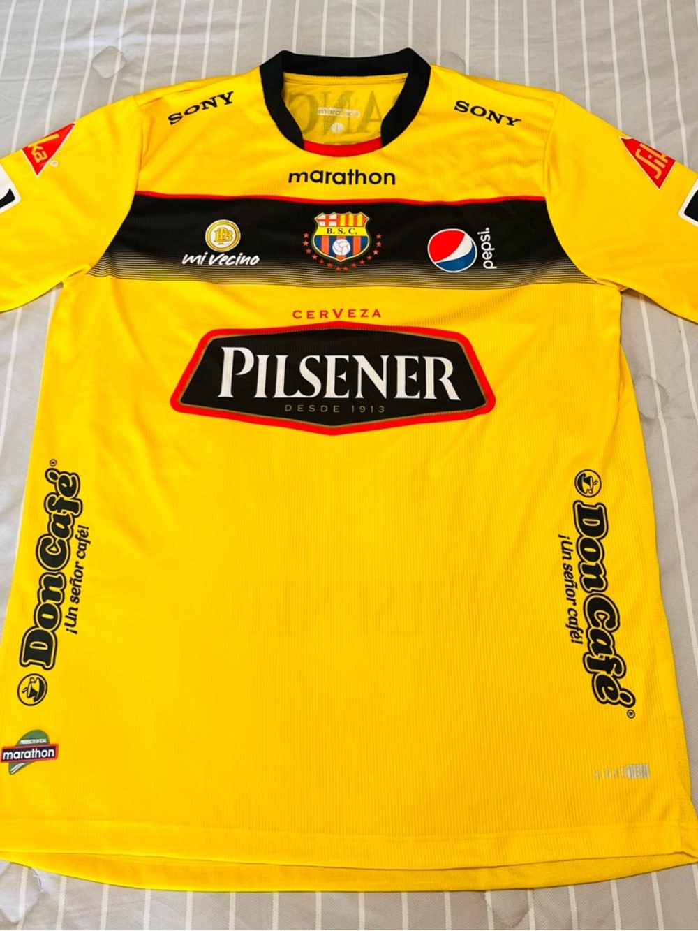 The Marathon Clothing Yellow and Black Barcelona SC Pilsener Soccer Jersey